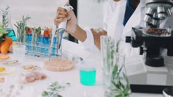 A woman in a lab coat is working on a project video