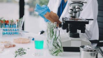 A woman in a lab coat is working on a project video
