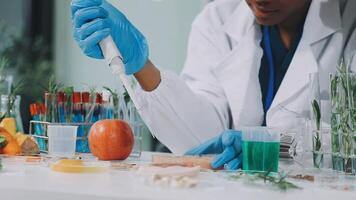 A woman in a lab coat is working on a project video