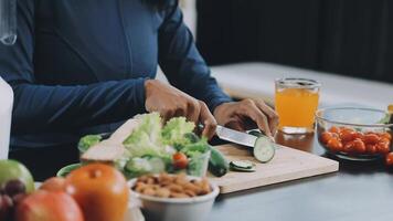 A woman cutting vegetables on a cutting board video
