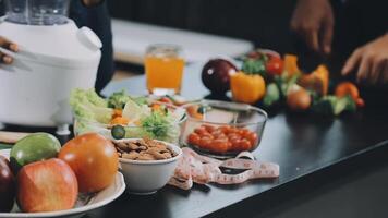 A person is preparing food on a counter with a blender video