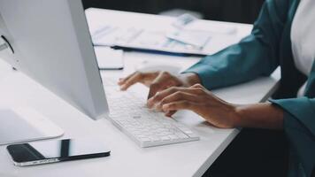 A person typing on a computer keyboard video