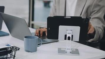 A person is using a tablet on a desk video