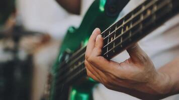 A person playing a bass guitar video