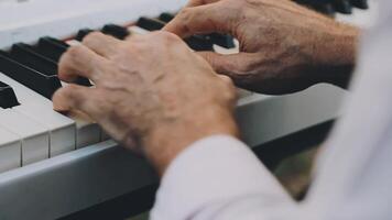 A close up of a person's hands playing the piano video