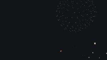 A person standing in the dark with a firework in the sky video