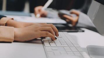 A person typing on a keyboard at a desk video