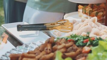 A buffet table with food and utensils video