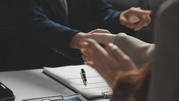 A business person shaking hands with another person video