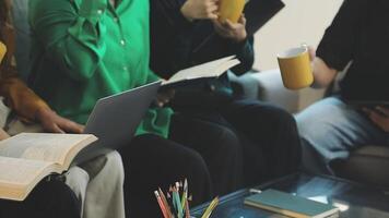 Group of people sitting on couch with laptops and books video