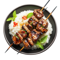 Perfectly grilled moo ping pork skewers served on a bed of fragrant rice png