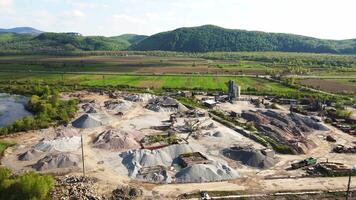 Aerial view Flight over a large plant for the production of stone and rubble of various fractions. Stone mountains and a large area of the stone extraction plant video