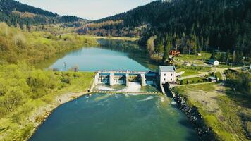 Aerial view small dam on the river. A small power plant of local significance. video