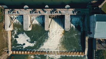 Aerial view on top small dam on the river. A small power plant of local significance. video