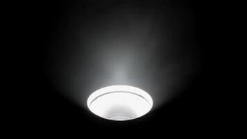 Ceiling light fixture illuminating in a dark room, Close-up of a ceiling light emitting bright rays in a dark space. video