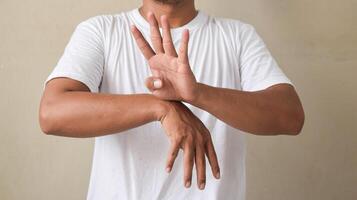 young man showing sign language with hand gestures speaking body language photo