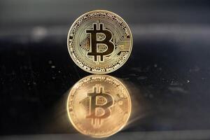 bitcoin on a mirroring background photo