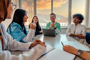 A medical team of doctors discussing at a meeting in the conference room. photo