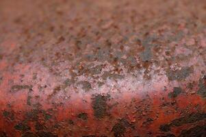 Rusty surface reveals stories of time and elements in an abandoned industrial setting photo
