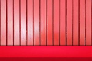 Red Table with Wooden Striped Wall Background, Suitable for Product Presentation Backdrop, Display, and Mock up in Lunar New Year Concept. photo