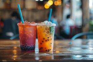 Two refreshing bubble tea drinks sitting on a table photo