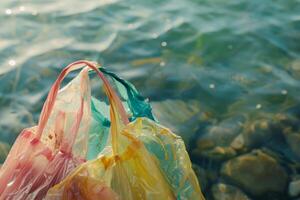 Plastic bags floating in ocean water polluting the environment photo