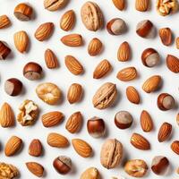 Mixed nuts forming a pattern on white background photo