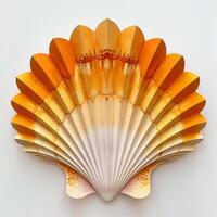 Decorative paper seashell imitating scallop shell on white background photo