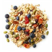 Rolled oats combined with nuts, seeds, and dried fruits creating a nutritious breakfast photo