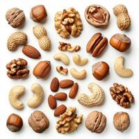 Various nuts forming a colorful pattern on white background photo