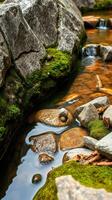 A stream of water running through a rocky area photo