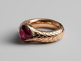 Close up of a ruby gemstone ring with a snake like design photo