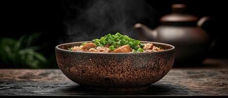 Steaming bowl of noodles with meat and green onions photo