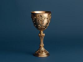 Ornate golden chalice with blue gems on dark background photo
