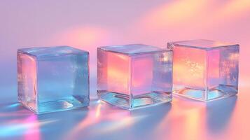 Transparent glass cubes arranged in a row displaying iridescent reflections and holographic effects, illuminated by pink and blue gradient lighting on a white background. shine photo