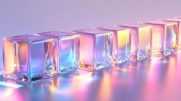 Transparent glass cubes arranged in a row displaying iridescent reflections and holographic effects, illuminated by pink and blue gradient lighting on a white background. translucent photo