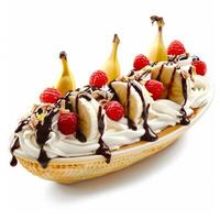 Banana split sundae drizzled with chocolate syrup and topped with raspberries and whipped cream photo
