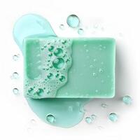 Soap bar with foam and water droplets on white background photo