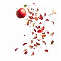 Red apple floating with colorful autumn leaves on white background photo