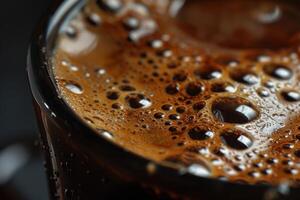 Close up of coffee foam bubbles creating textured surface in cup photo