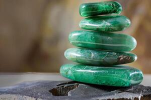 Stack of polished green aventurine stones creating harmony and balance photo