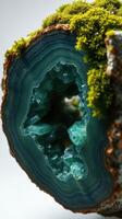A close up of a rock with a green and blue stone photo