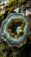 A piece of agate with a rock and some other items photo