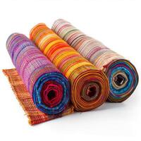 Colorful fabric rolls showing vibrant textures and patterns on white background photo