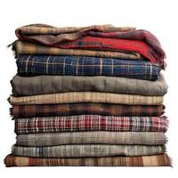 Stack of folded patchwork quilts and blankets creating warmth and comfort photo