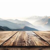 Empty wooden table displaying majestic mountain range at sunrise photo