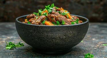 Delicious slow cooked meat stew with orange slices and fresh parsley in a rustic bowl photo