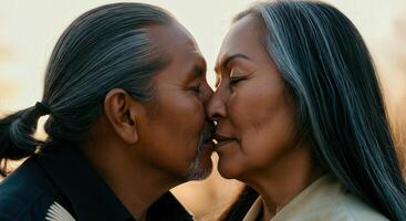 Tender moment between mature native american couple embracing romantic connection photo