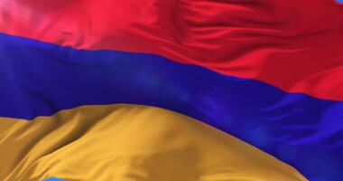 Armenia flag waving at wind in slow with blue sky, loop video
