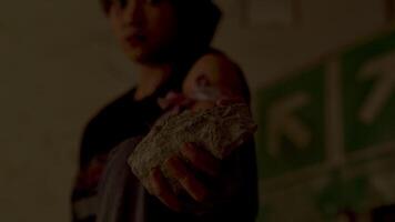 Person Holding a Rock in a Tense Moment video